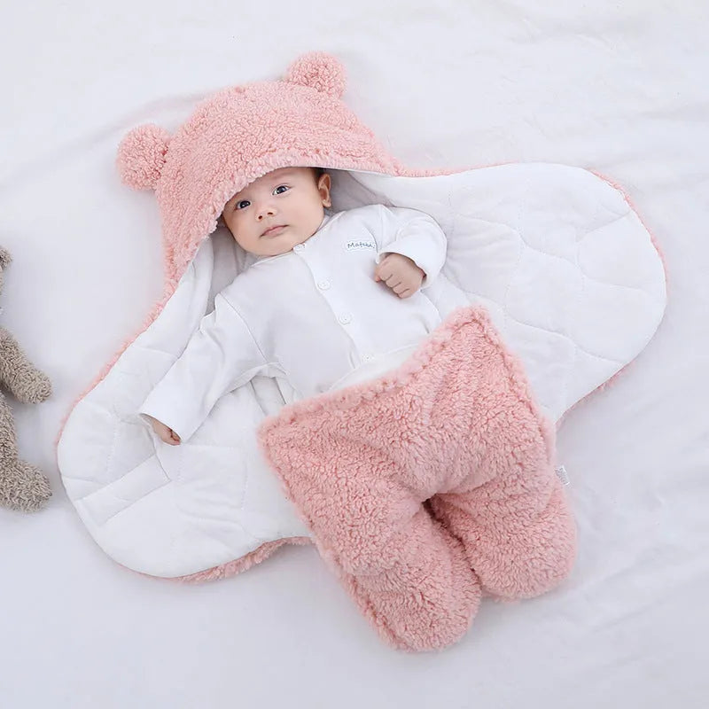 Cotton blend quilted baby sleeping bag wrapper in light blue, shown laid flat.