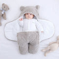 Cotton blend quilted baby sleeping bag wrapper in light blue, shown laid flat.