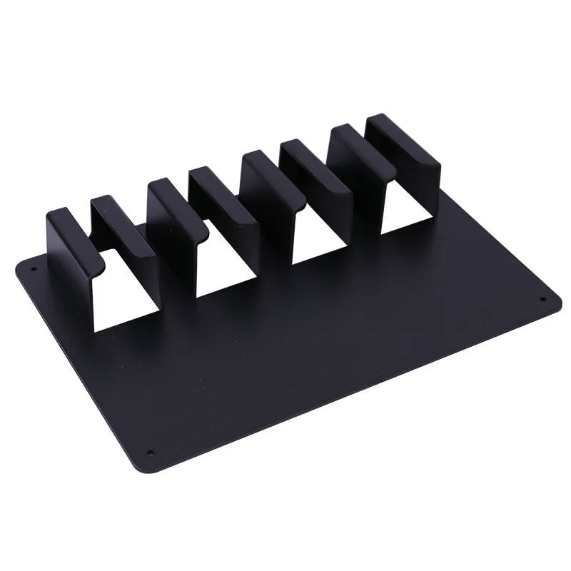 Black plastic wall-mounted frame holding four electric hair clippers.
