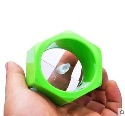 Yellow and green manual spiral vegetable cutter with stainless steel blades for cucumber carrot preparation