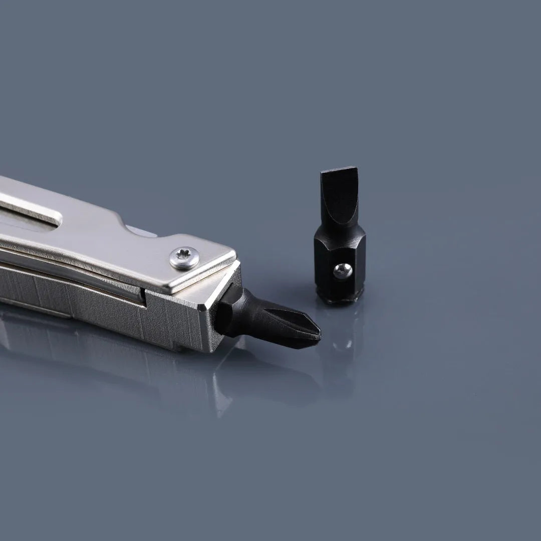 White stainless steel multi-function tool with wrench, knife, and needle nose pliers functions