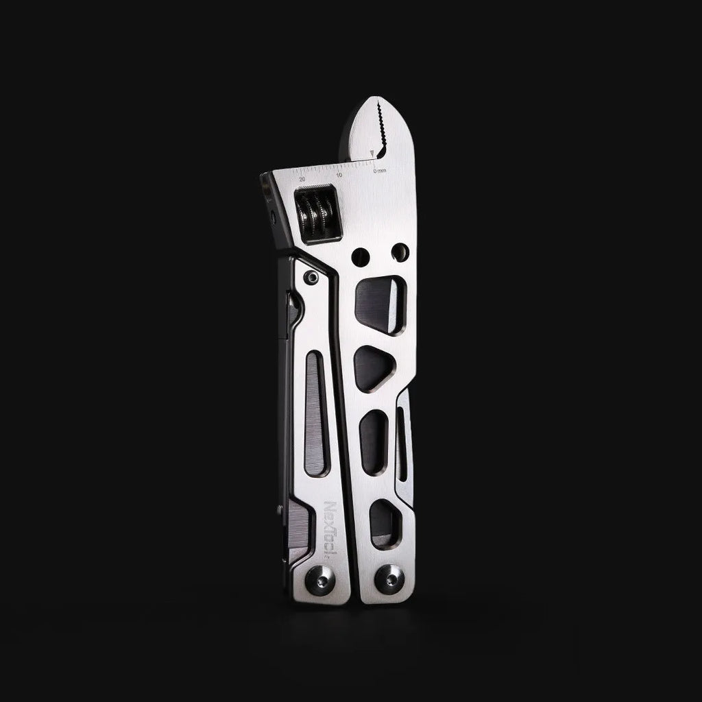 White stainless steel multi-function tool with wrench, knife, and needle nose pliers functions
