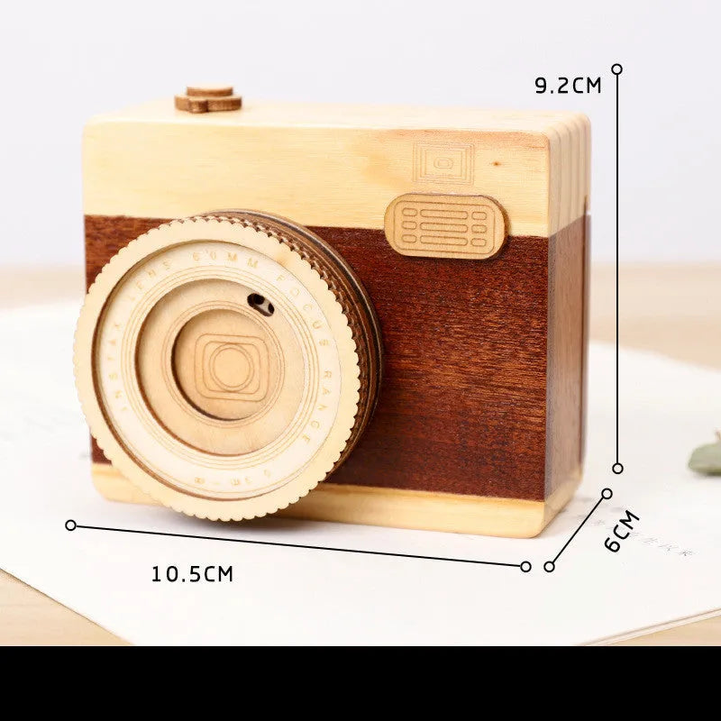 Wooden camera music box with rotating mechanism and sanding finish in carton packaging