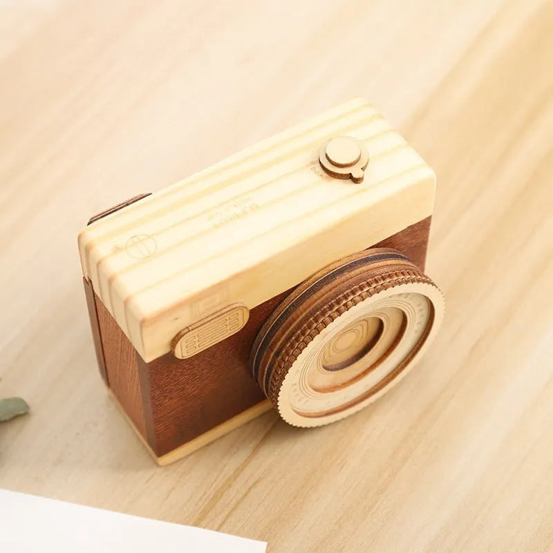 Wooden camera music box with rotating mechanism and sanding finish in carton packaging