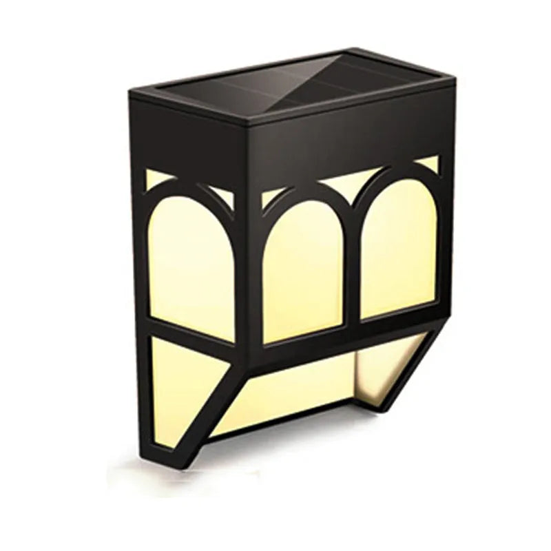 Square white solar-powered wall lamp mounted on an outdoor fence post.