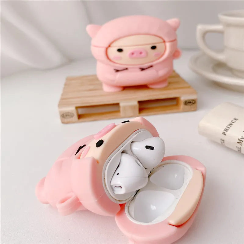 Pink silicone AirPods case with cartoon pig design and hook attachment