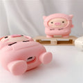 Pink silicone AirPods case with cartoon pig design and hook attachment