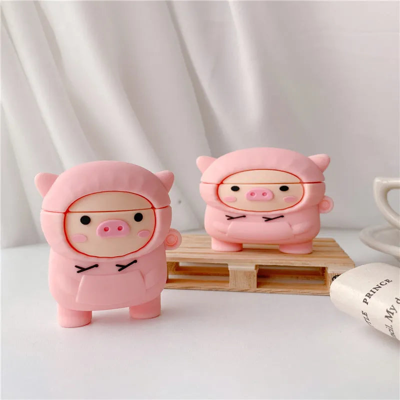 Pink silicone AirPods case with cartoon pig design and hook attachment