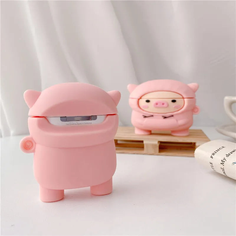 Pink silicone AirPods case with cartoon pig design and hook attachment