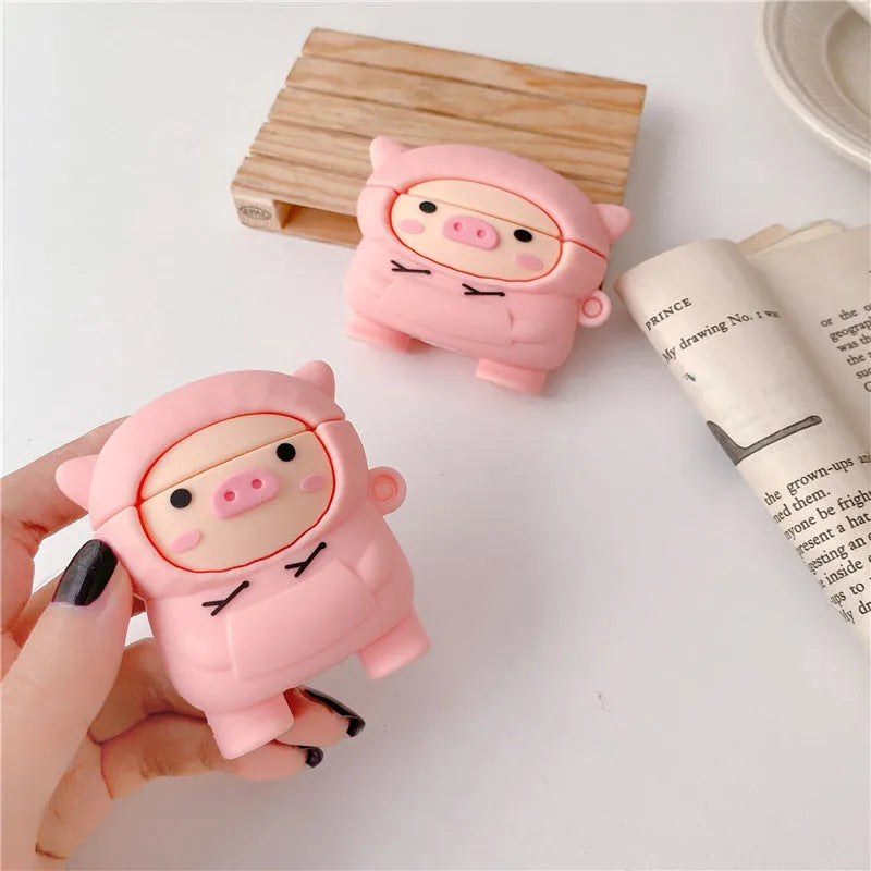 Pink silicone AirPods case with cartoon pig design and hook attachment