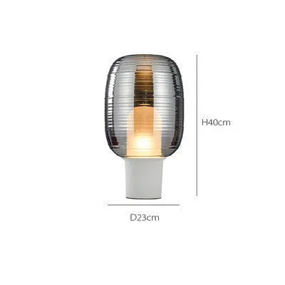 Modern Nordic-style glass table lamp in Cognac colour with a push-button switch.