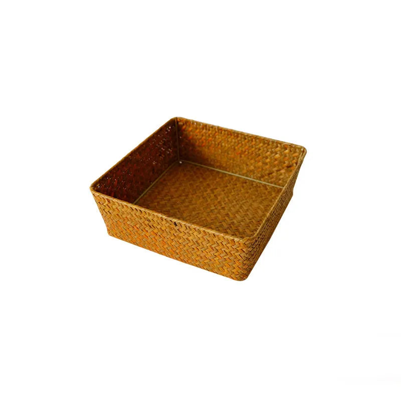 Natural woven straw desk storage box for organising pens and cosmetics, shown in brown colour.