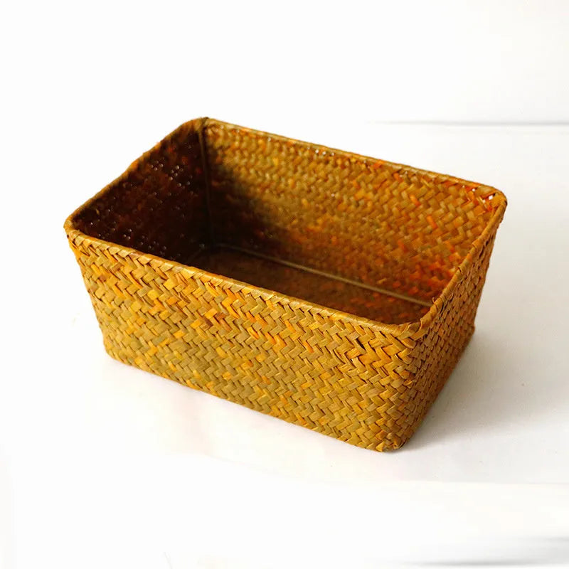 Natural woven straw desk storage box for organising pens and cosmetics, shown in brown colour.