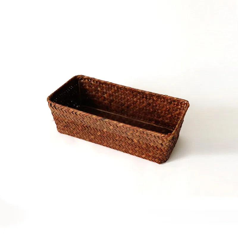 Natural woven straw desk storage box for organising pens and cosmetics, shown in brown colour.