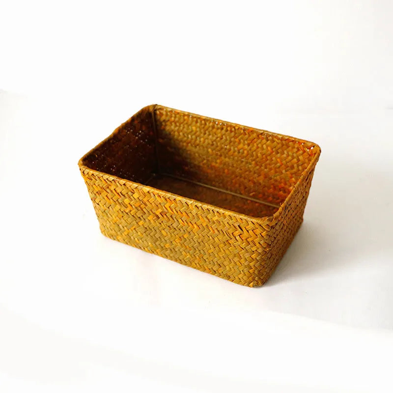 Natural woven straw desk storage box for organising pens and cosmetics, shown in brown colour.