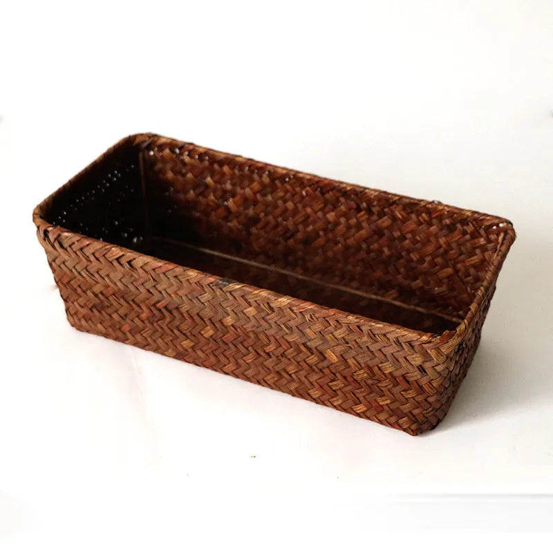 Natural woven straw desk storage box for organising pens and cosmetics, shown in brown colour.