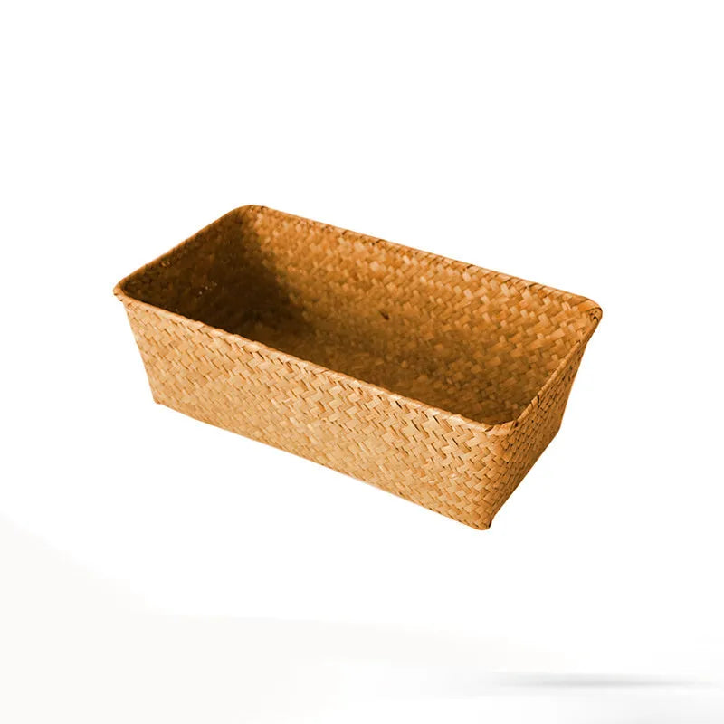 Natural woven straw desk storage box for organising pens and cosmetics, shown in brown colour.