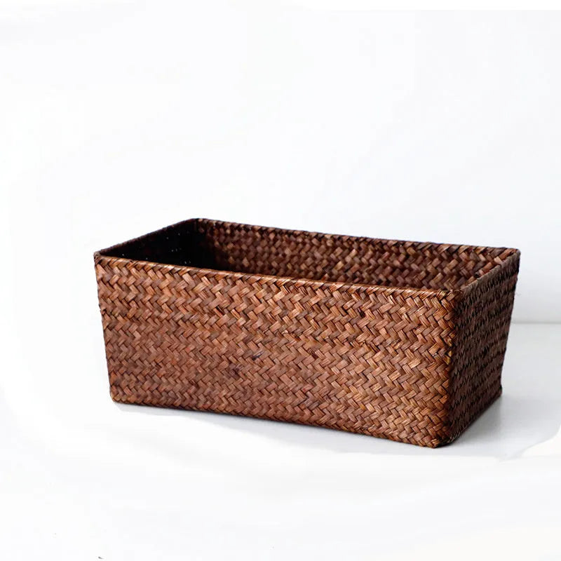 Natural woven straw desk storage box for organising pens and cosmetics, shown in brown colour.