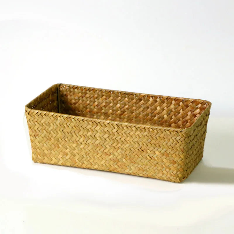 Natural woven straw desk storage box for organising pens and cosmetics, shown in brown colour.