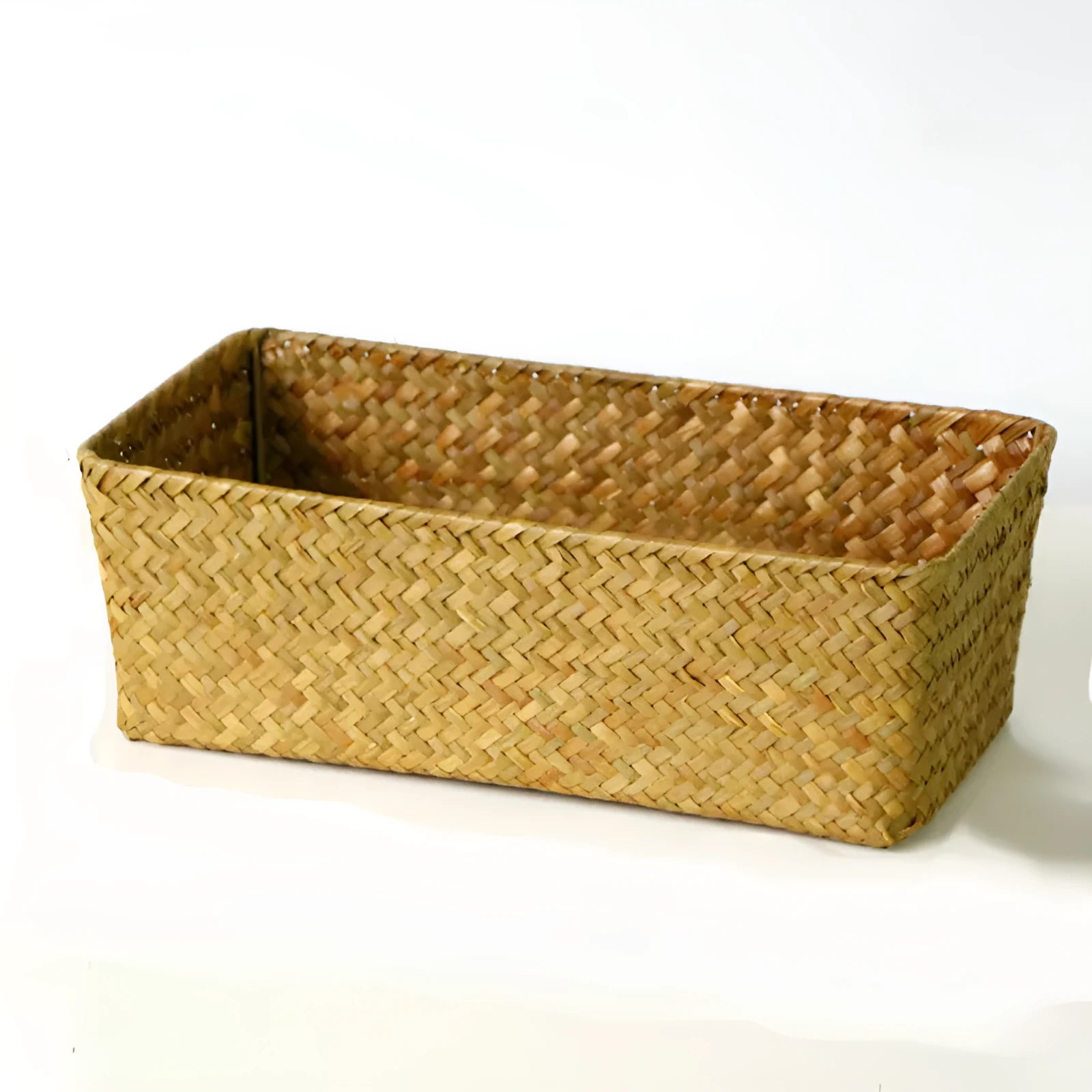 Natural woven straw desk storage box for organising pens and cosmetics, shown in brown colour.