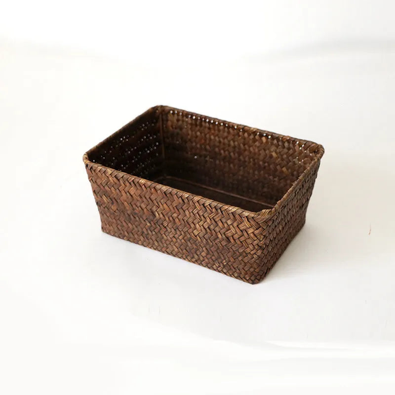 Natural woven straw desk storage box for organising pens and cosmetics, shown in brown colour.