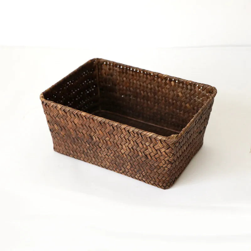 Natural woven straw desk storage box for organising pens and cosmetics, shown in brown colour.
