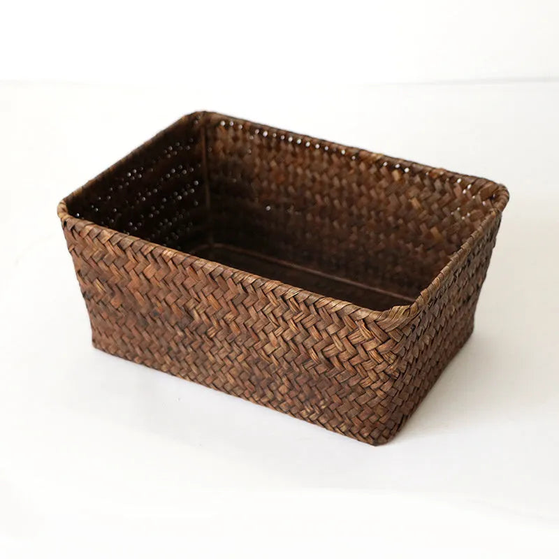 Natural woven straw desk storage box for organising pens and cosmetics, shown in brown colour.
