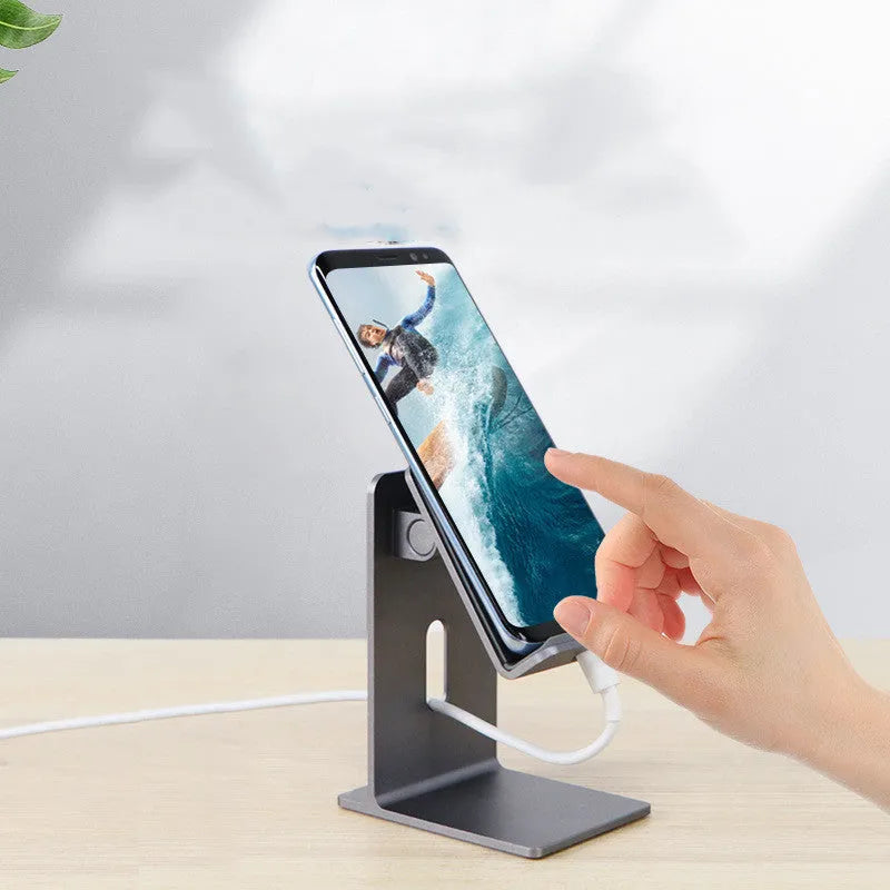 Alloy mobile phone holder bracket on desktop holding phone