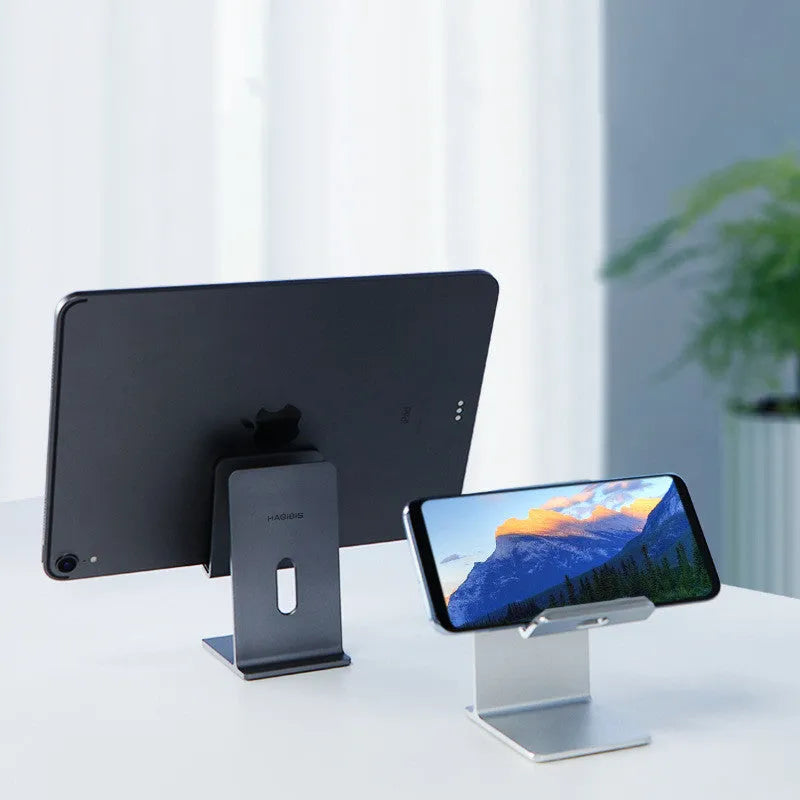 Alloy mobile phone holder bracket on desktop holding phone