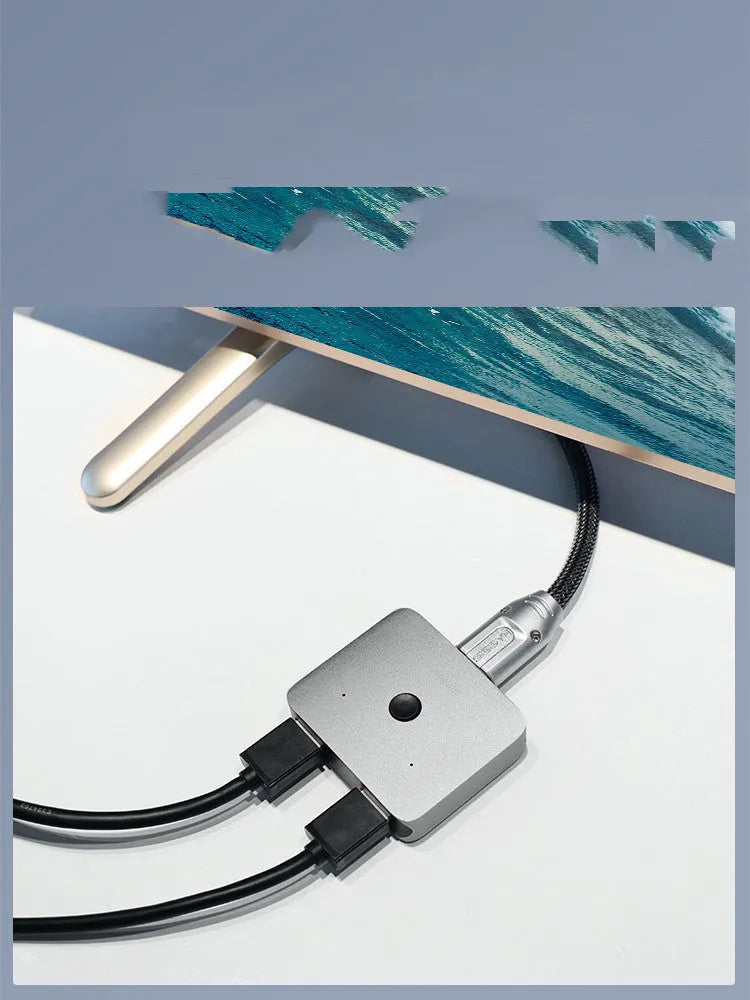 Grey HDMI switcher with two input ports and one output port for computer TV monitor connectivity