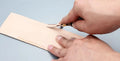 Barber thinning knife with wide shovel edge and leather handle for sectional cutting