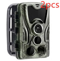 Green cellular trail camera with belt and tripod mount for hunting and wildlife monitoring
