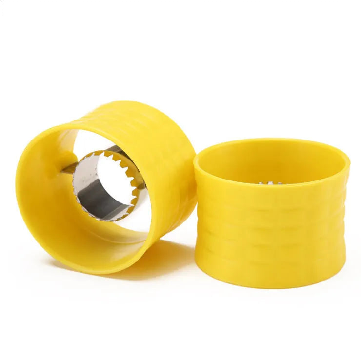 Yellow corn-shaped manual kitchen thresher for peeling corn kernels.