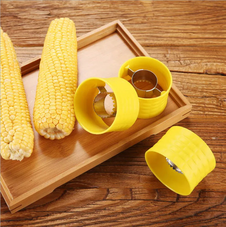 Yellow corn-shaped manual kitchen thresher for peeling corn kernels.
