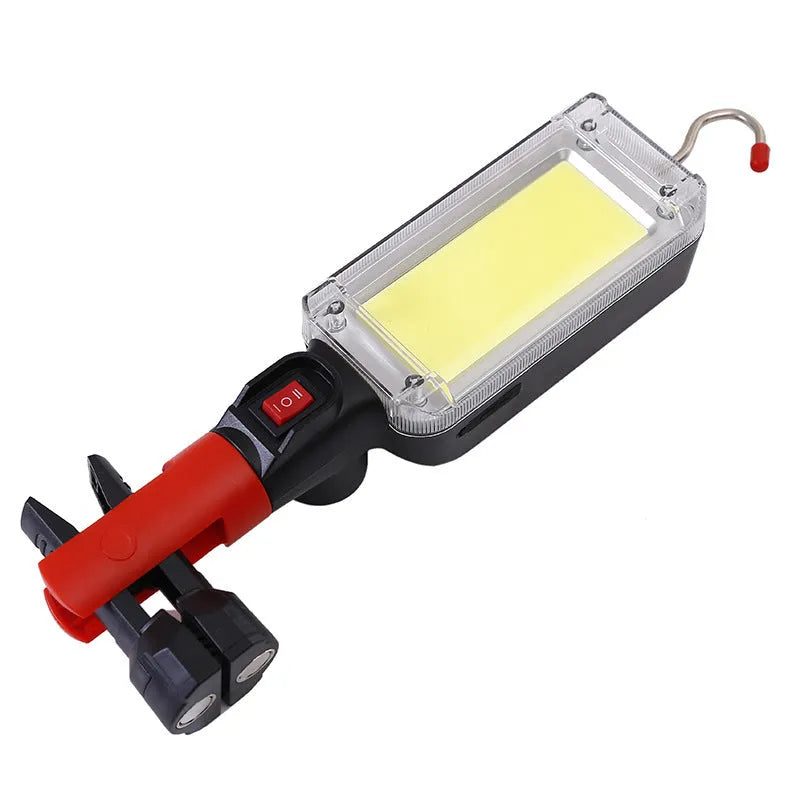 Red portable COB LED work light with magnet hook showing 28.8cm length and USB charging port