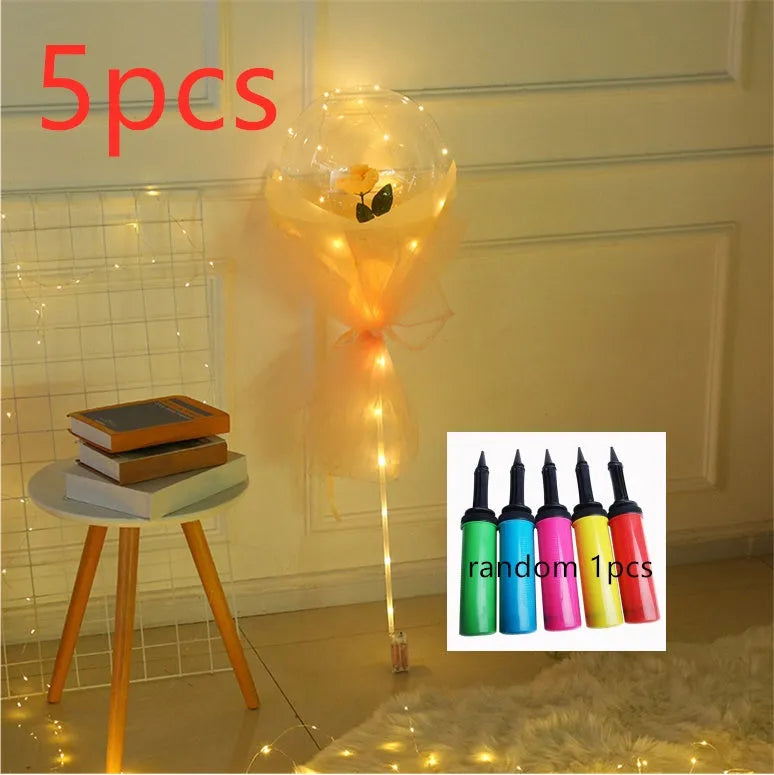 Transparent LED luminous balloon bouquet with artificial rose and glowing light inside, displayed as a DIY kit.
