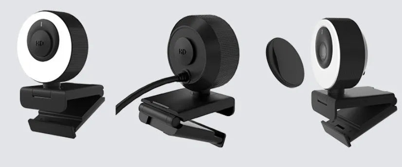 Black 1080p USB webcam with built-in microphone and magnetic privacy cover on a computer monitor.