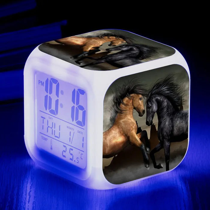 Small square plastic alarm clock with LED digital display showing time and temperature.