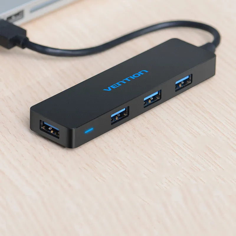 Black four-port USB 3.0 hub with 0.15 metre cable showing nickel-plated connectors
