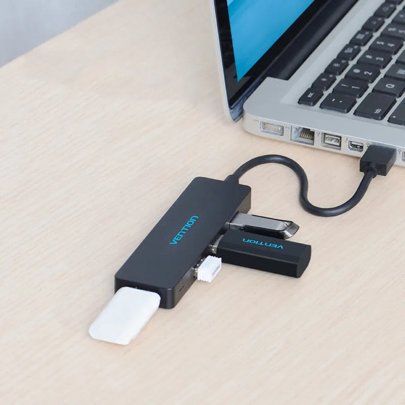 Black four-port USB 3.0 hub with 0.15 metre cable showing nickel-plated connectors