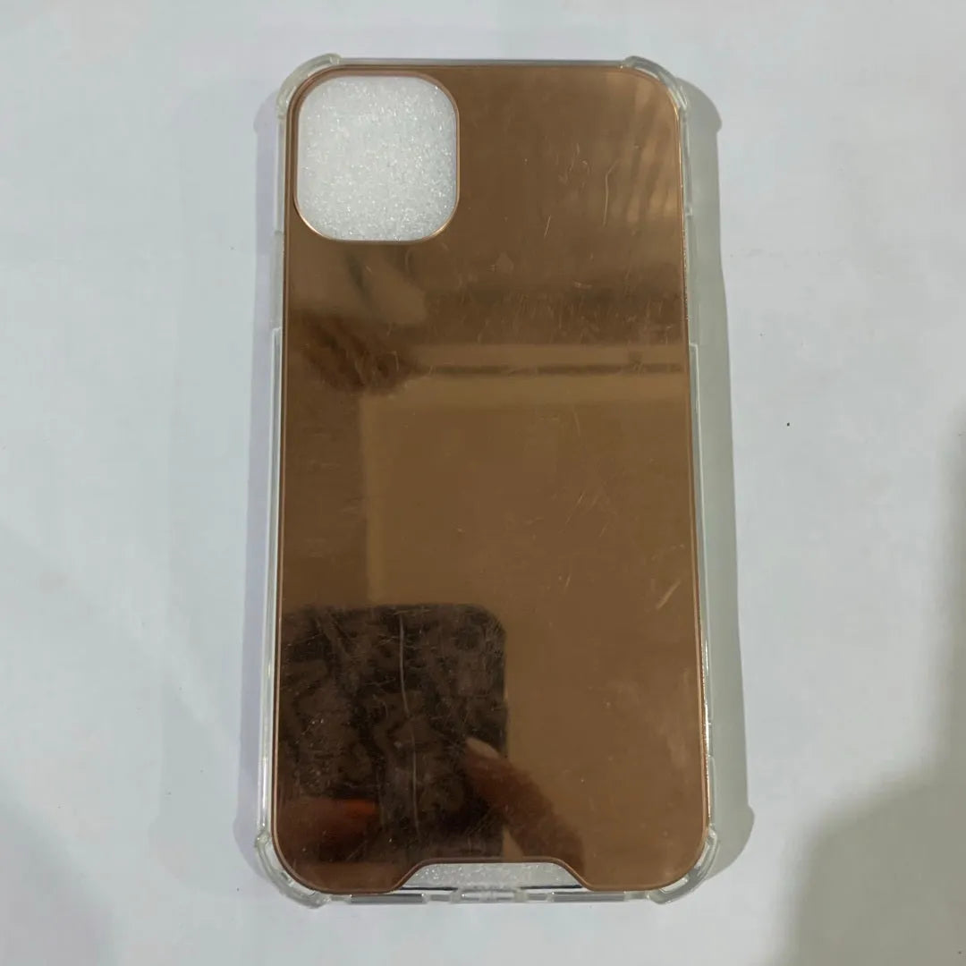 Mirror finish protective TPU case for iPhone shown in various colours.