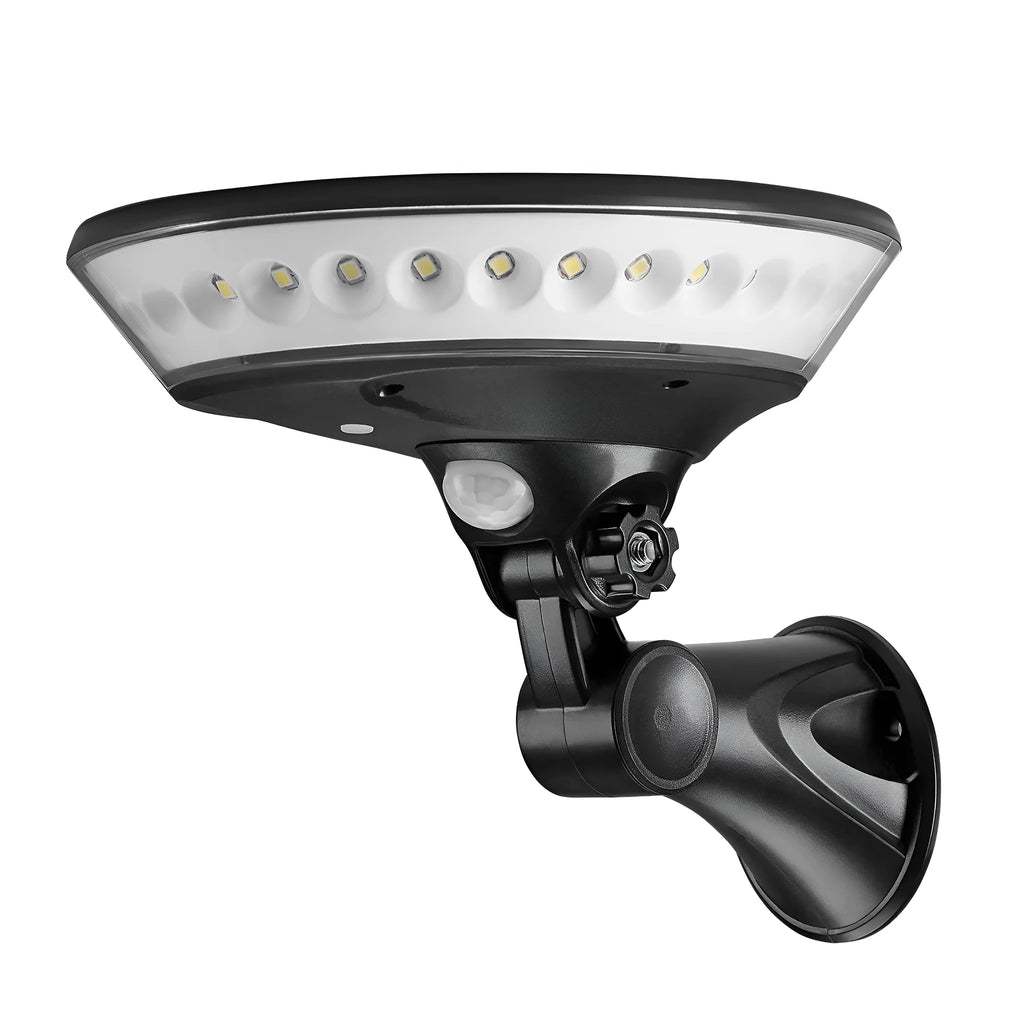 White 360-degree solar-powered outdoor light with motion sensor on a black stake for garden installation.