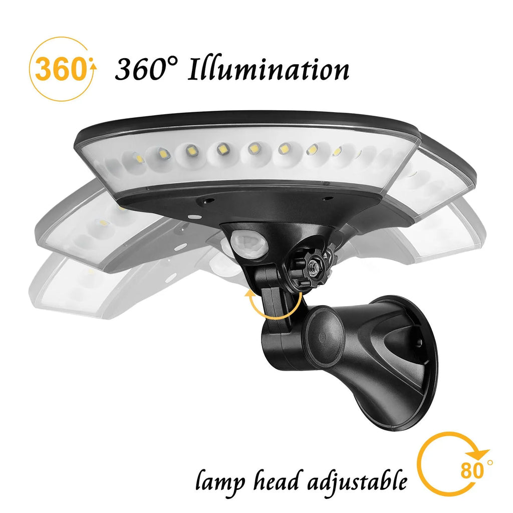 White 360-degree solar-powered outdoor light with motion sensor on a black stake for garden installation.
