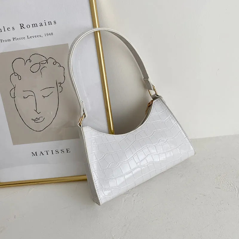 Korean-style small square underarm bag in PU material showing colour options including beige, black and animal prints