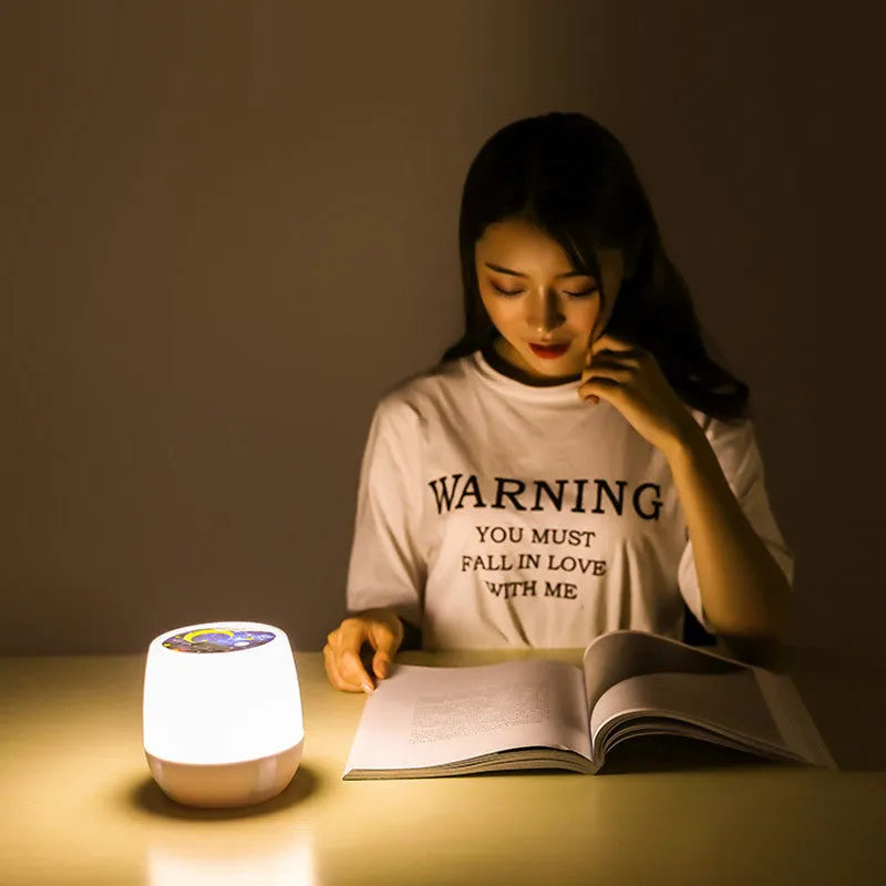 Pruixin PRX1363 LED projector night light displaying rotating star pattern on a ceiling.