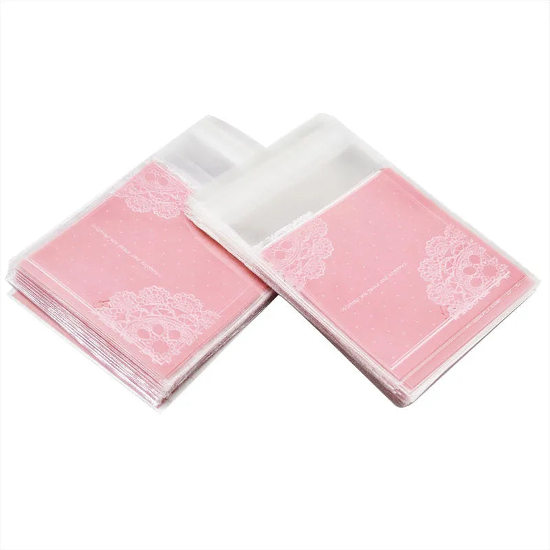 Pink self-adhesive plastic packaging bags with UV printed surface, shown in a pack.