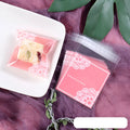 Pink self-adhesive plastic packaging bags with UV printed surface, shown in a pack.