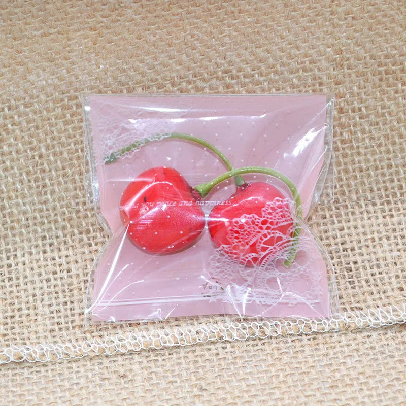 Pink self-adhesive plastic packaging bags with UV printed surface, shown in a pack.
