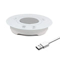 Black USB-powered hot and cold drink coaster with tempered glass top on a wooden desk.