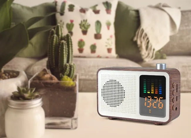 Brown wooden retro Bluetooth speaker with AM/FM radio, brass tuning dials and analogue display
